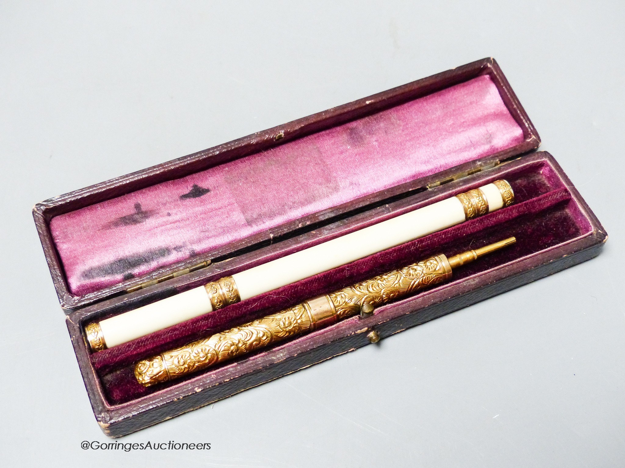 An antique French gold mounted ivory combined pen/pencil and a combined telescopic pen/pencil